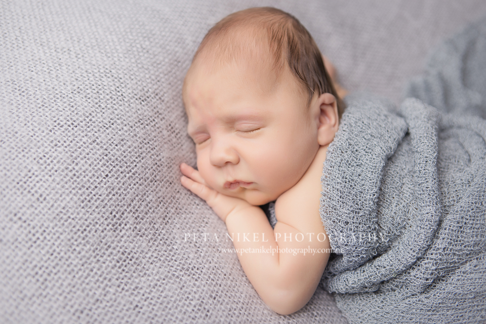 Beautiful baby boy, newborn portraits taken in studio by Hobart Photographer Peta Nikel