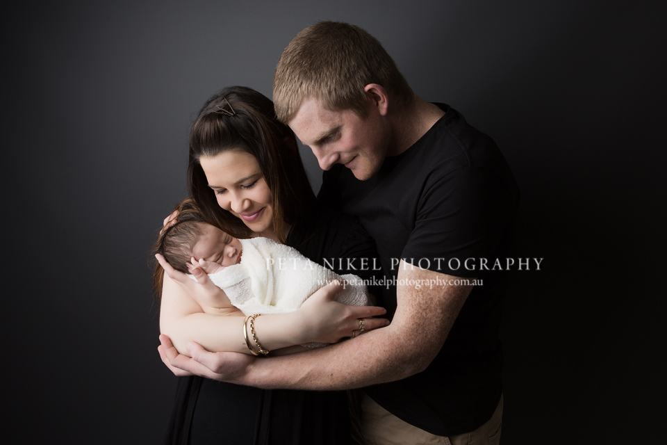 Baby with parents photo taken in Hobart studio by Peta Nikel